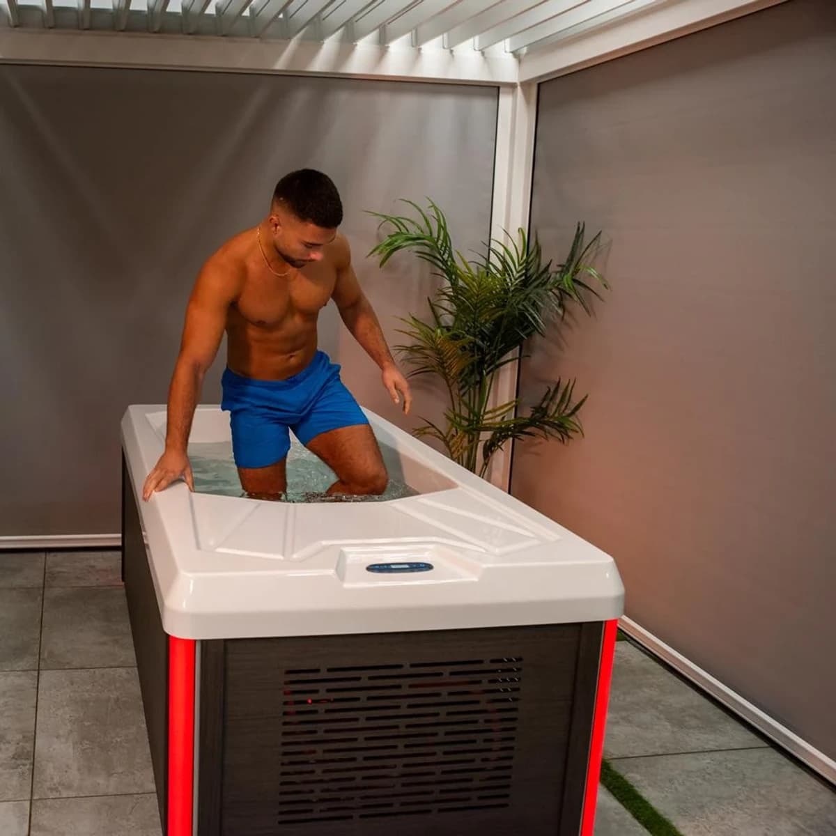 Person stepping into a Chill Tubs Pro cold plunge