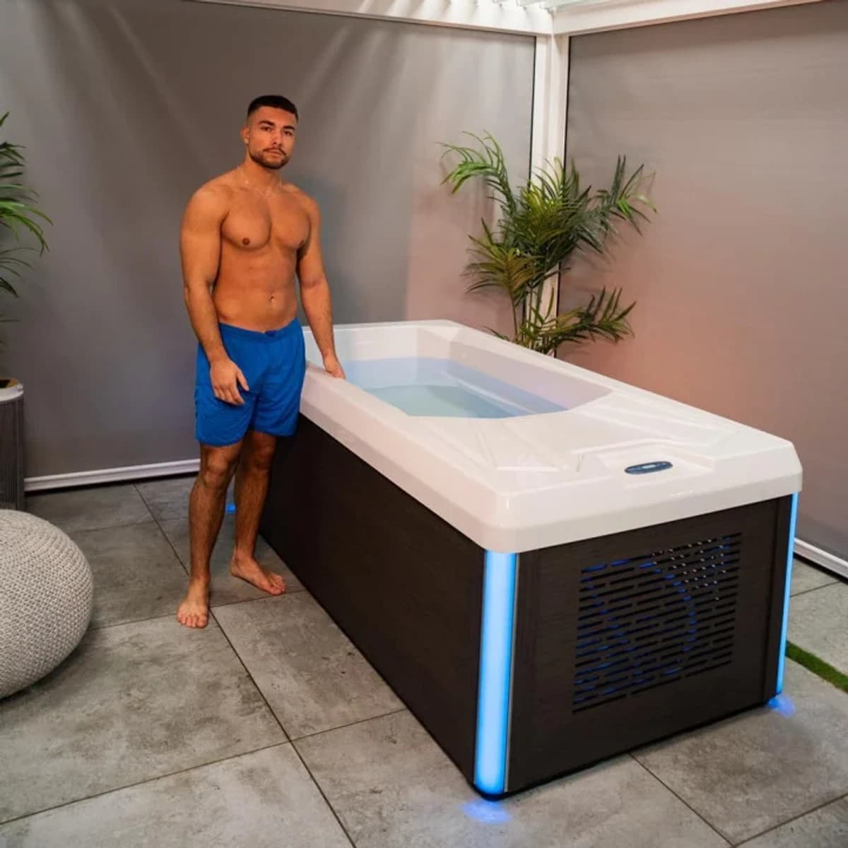 Person beside an open Chill Tubs Pro cold plunge