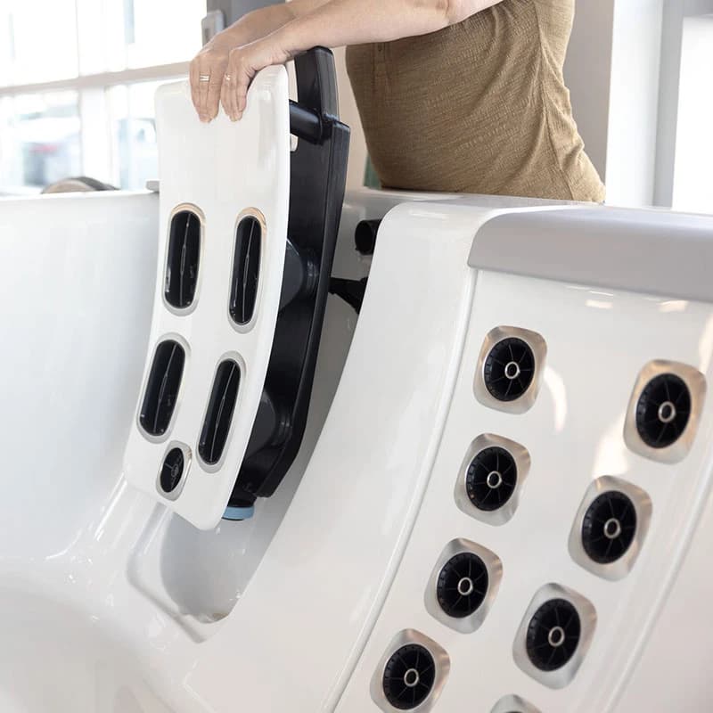 Bullfrog STIL JetPak massage unit being adjusted in a STIL hot tub seat