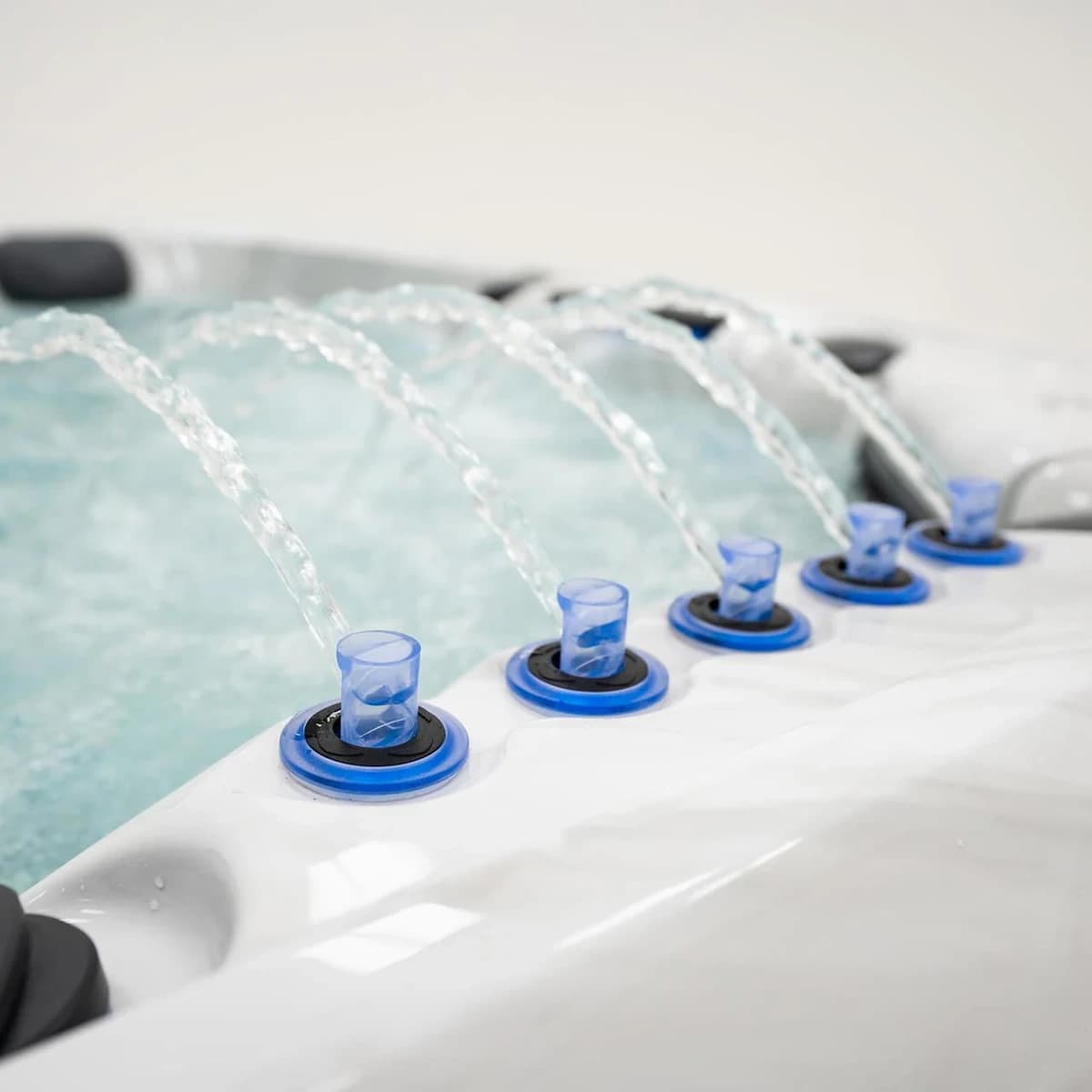 Platinum Spas Barcelona hot tub illuminated water features along the spa edge