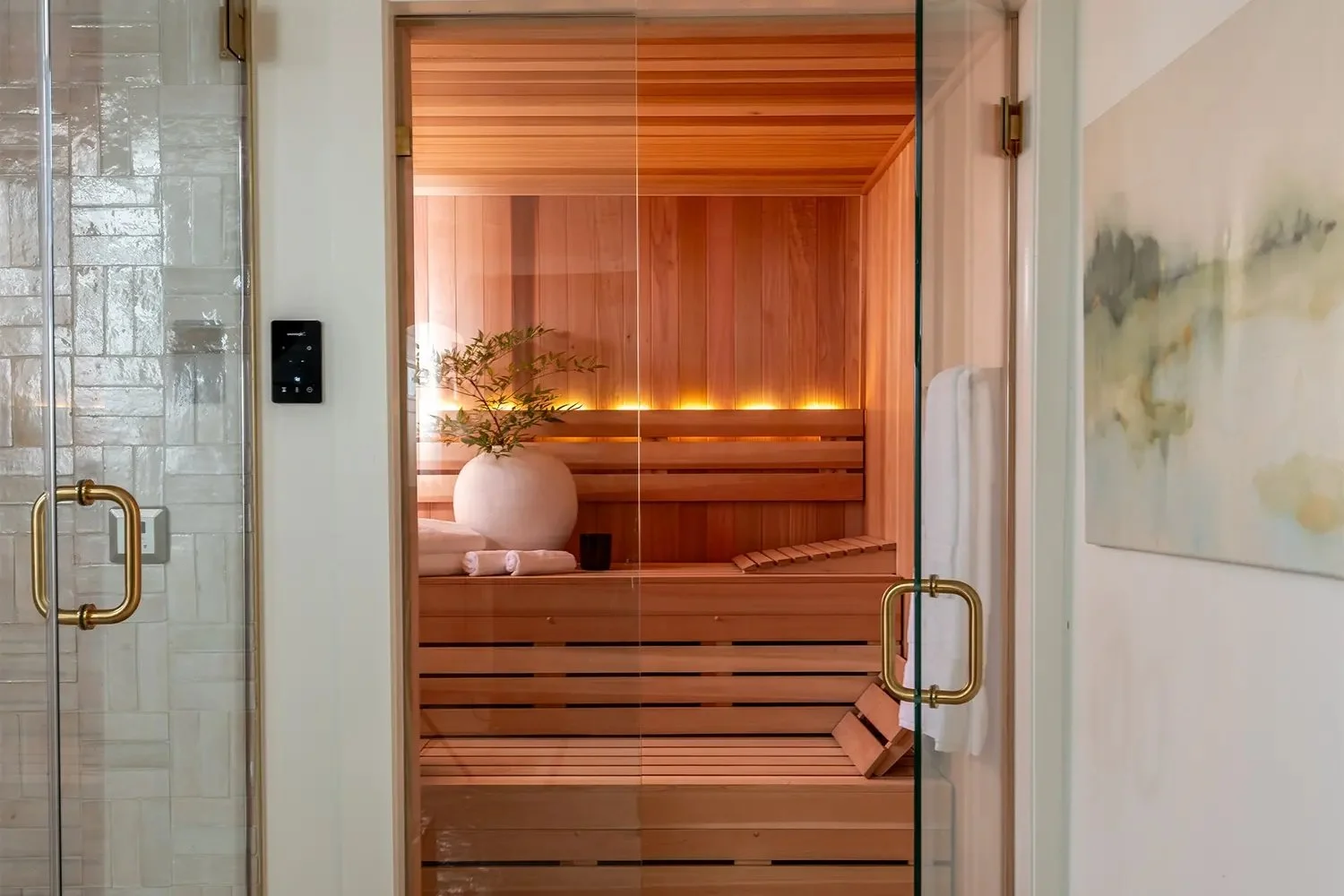 Finnleo traditional sauna with glass entry and warm wood interior