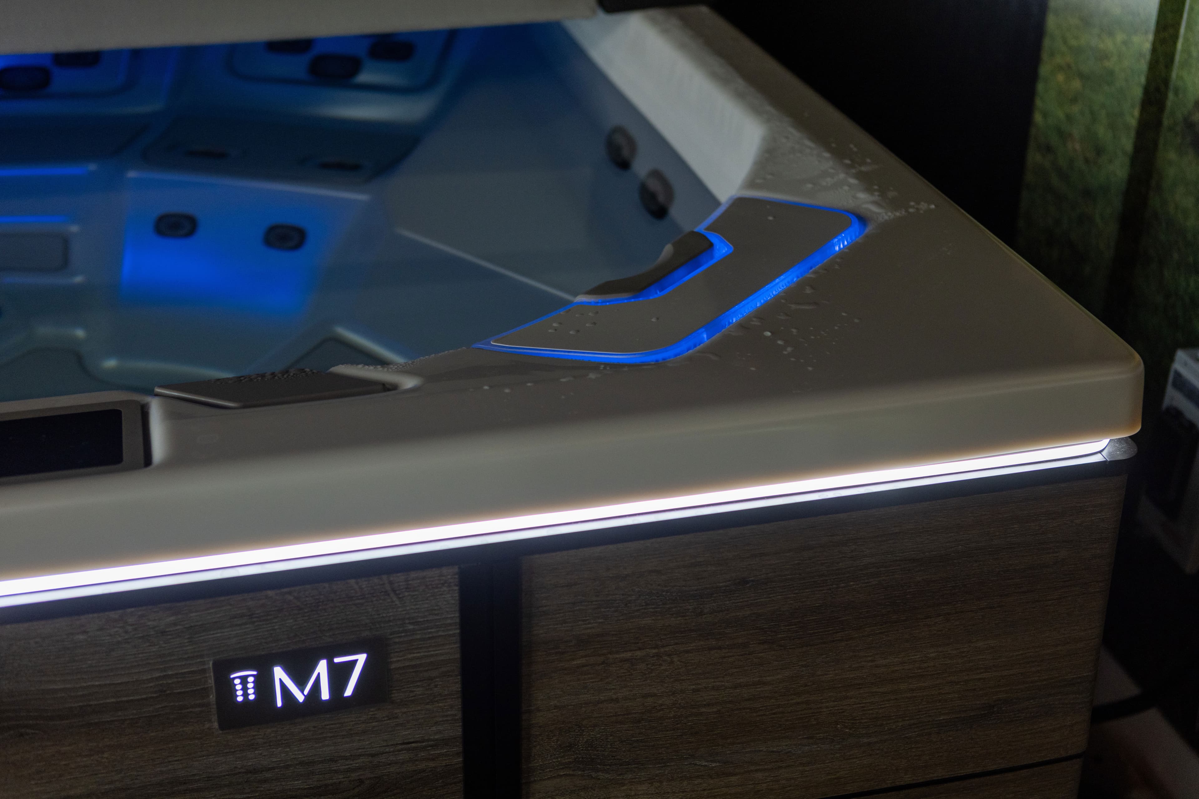 M7 hot tub edge glowing with blue LED lighting