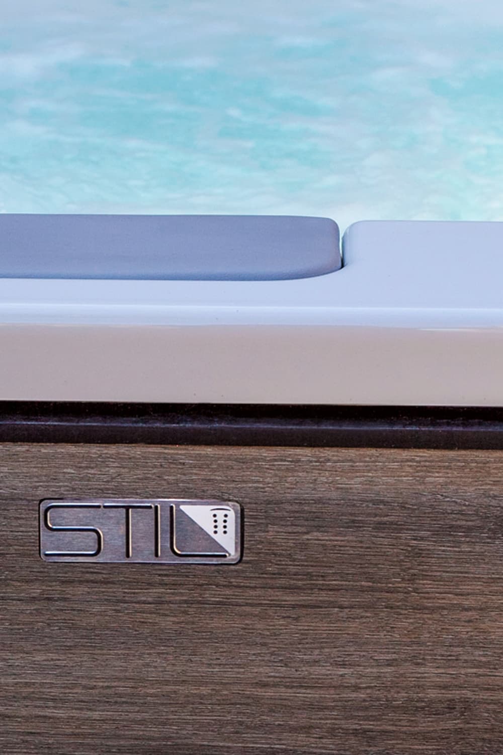 Two-tone wood-look cabinet with STIL badge