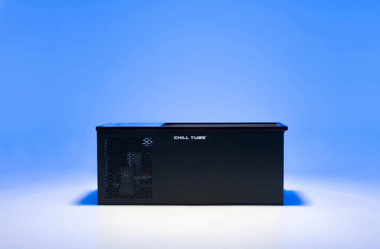 Side view of the Chill Tubs Original cold plunge in a blue-lit studio