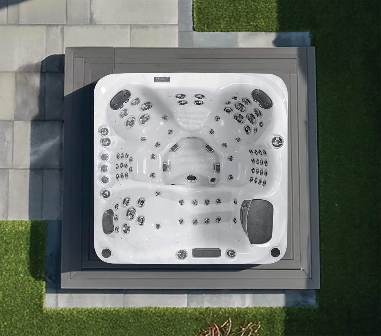Platinum Palma hot tub viewed from above on a patio, showing its upright seats and lounger