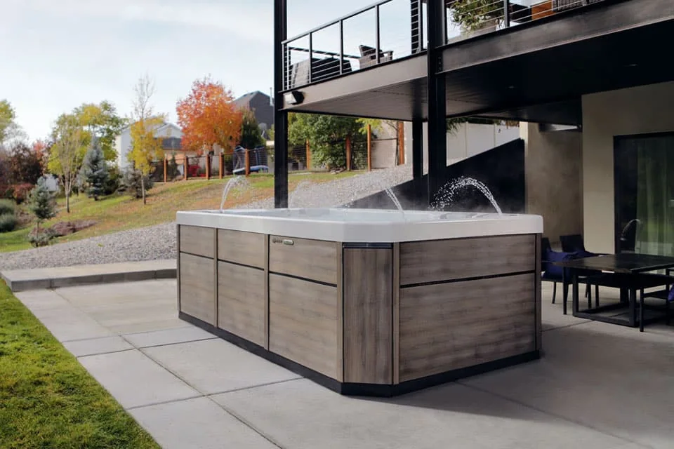 Bullfrog Spas Swim Series installed on a spacious outdoor patio