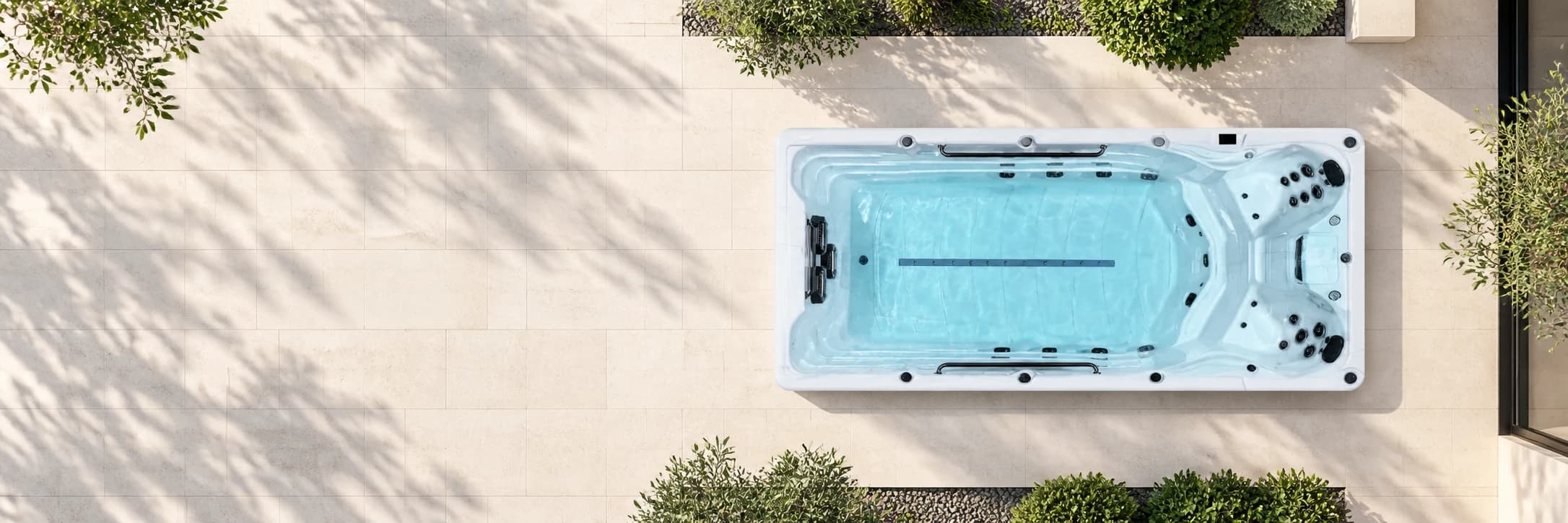 Platinum Eros swim spa in an illustrative limestone courtyard, viewed from above