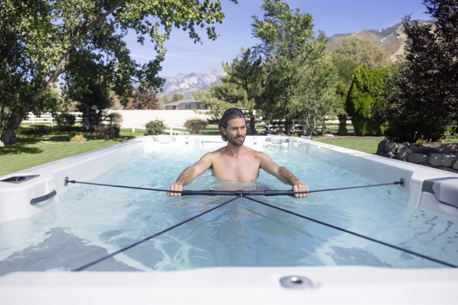 A swimmer using the current in a Bullfrog Swim Series spa