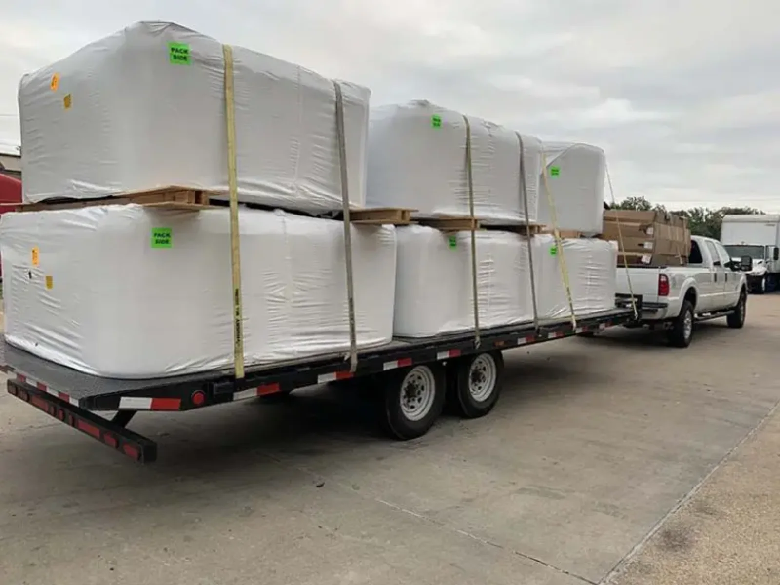 Southern Leisure delivery truck carrying wrapped spas for local installation