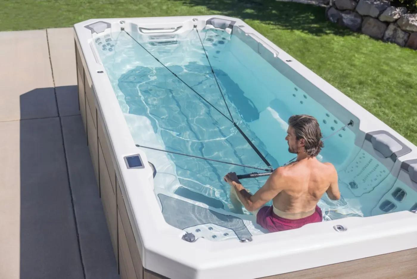 Bullfrog Spas Swim Series used outdoors on a bright backyard patio