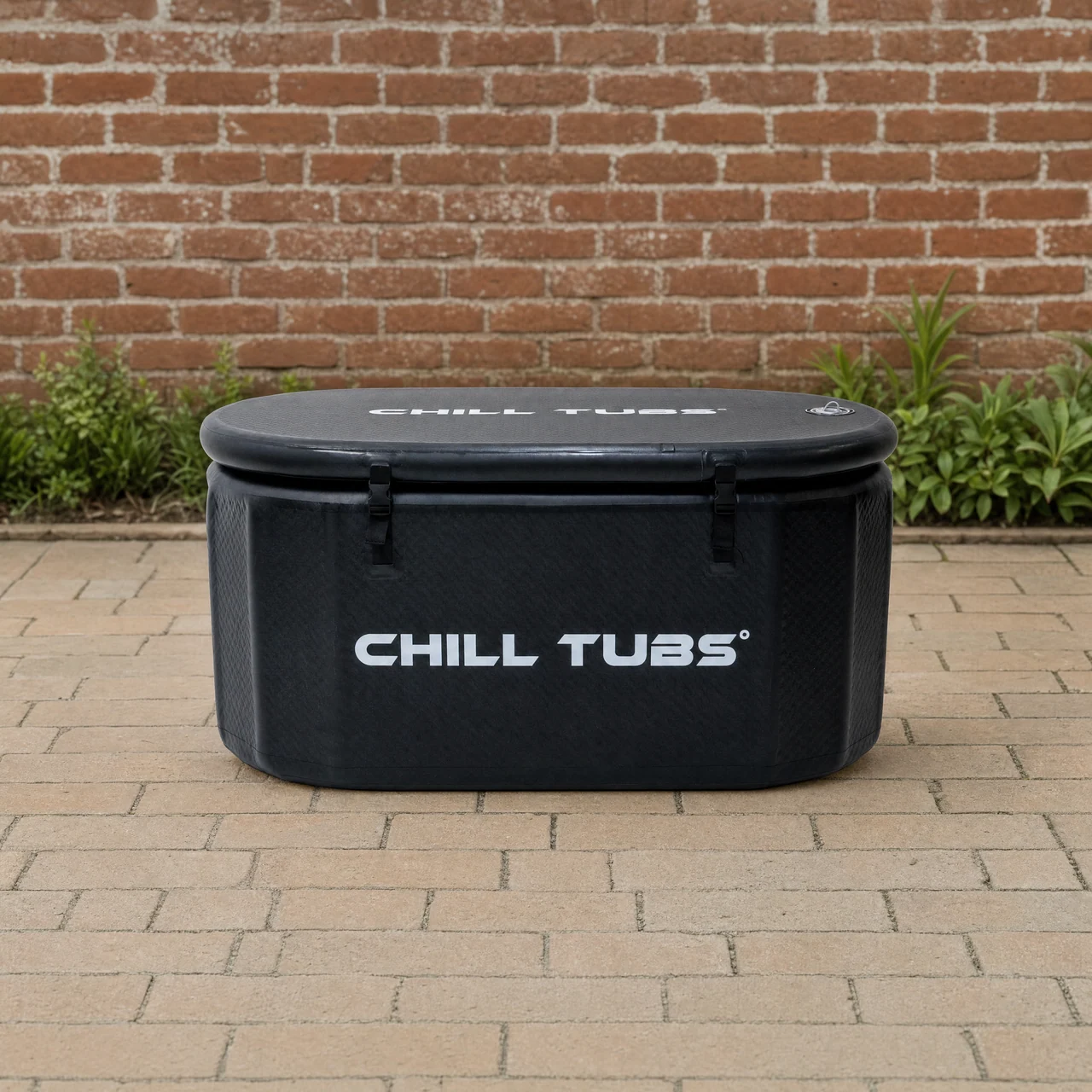 Chill Tubs Essential Bath with its supplied thermo lid secured in a quiet brick courtyard.