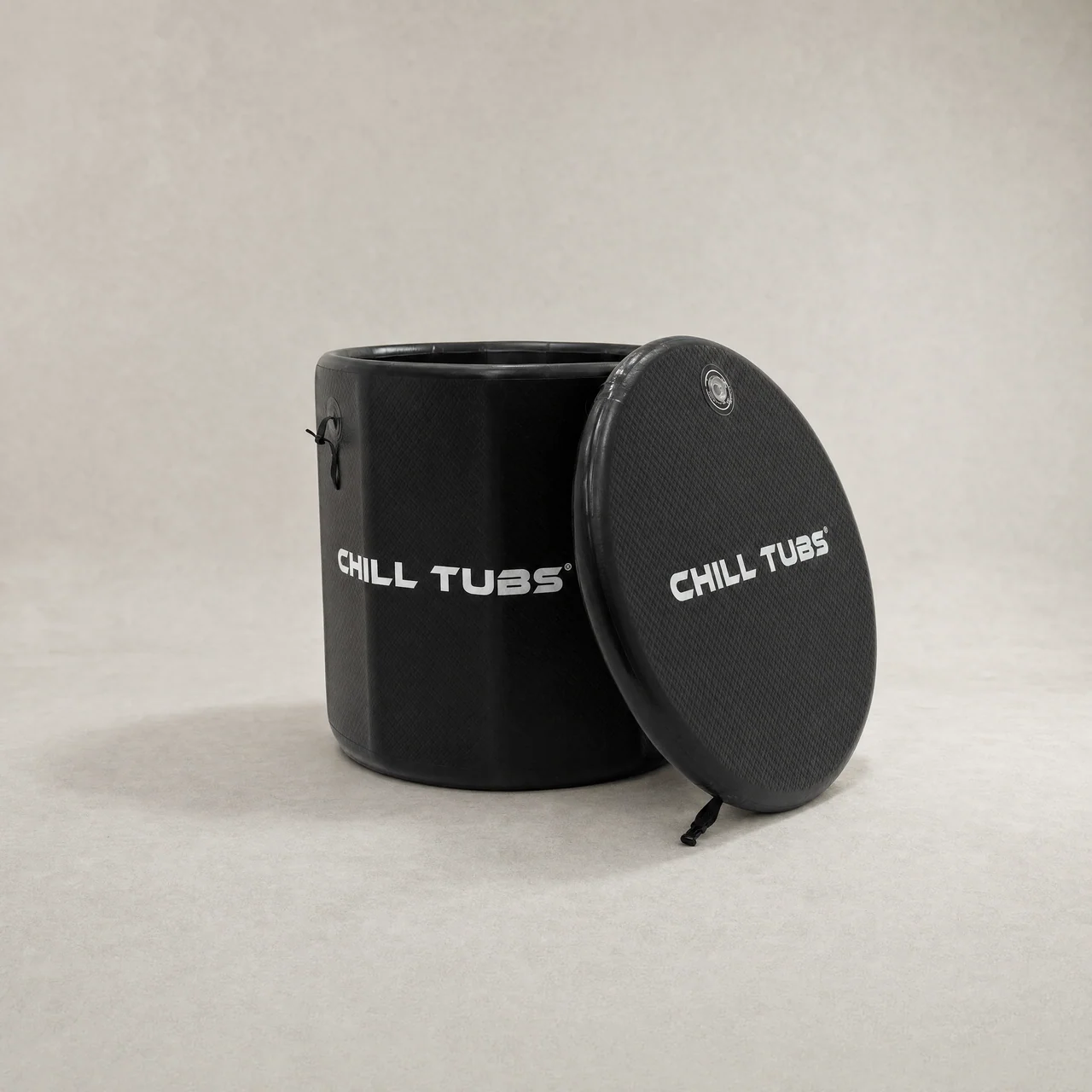 Chill Tubs Essential Pod shown open with its supplied circular thermo lid leaning beside it.