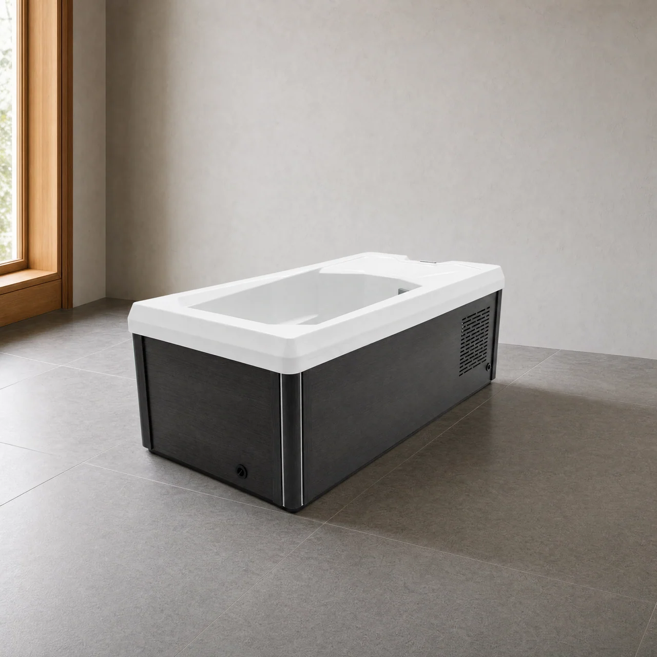 Chill Tubs Pro cold plunge viewed from the bath end in a softly lit wellness room.